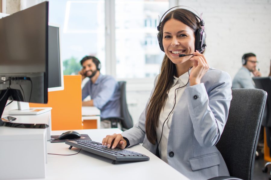 Female customer support operator working in call center. Help an Female customer support operator working in call center. Help and technical support concept.