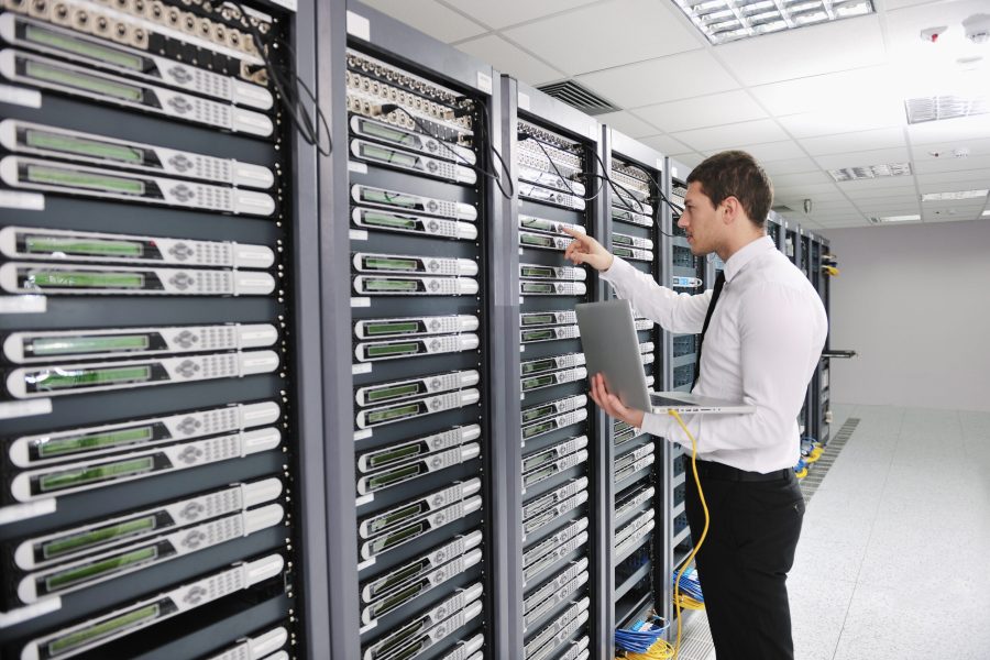 young engeneer in datacenter server room young handsome business man engeneer in datacenter server room