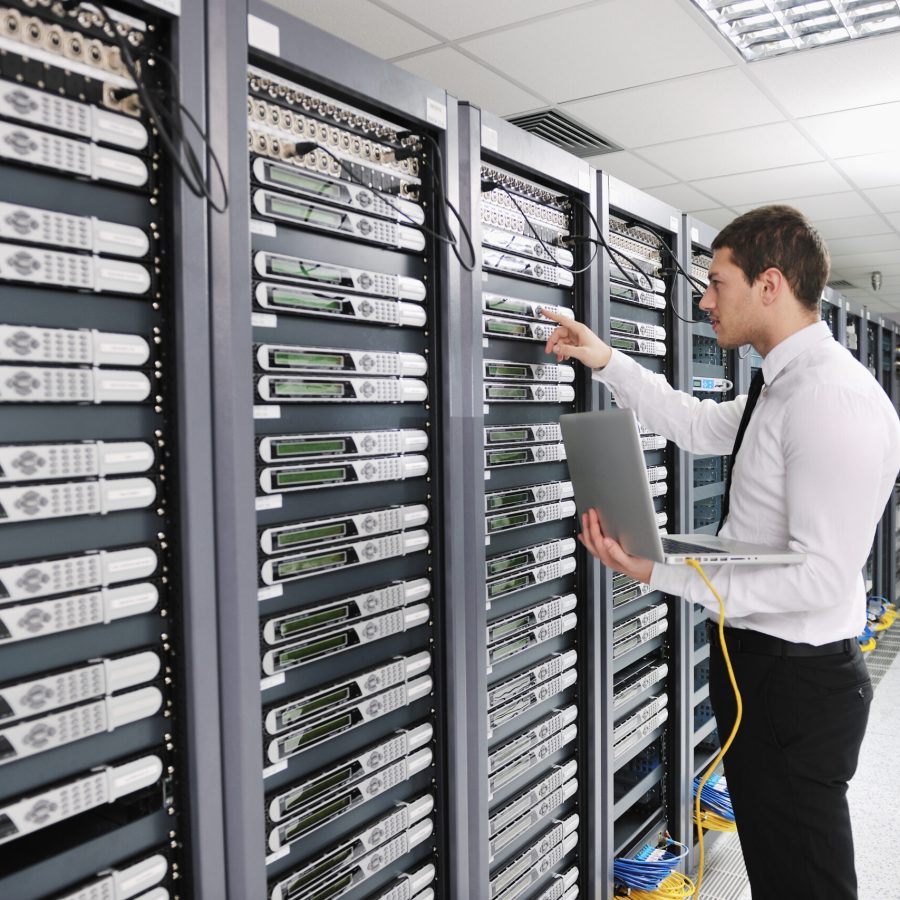 young engeneer in datacenter server room young handsome business man engeneer in datacenter server room